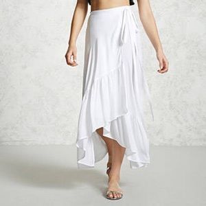White wrap skirt with ruffle trim.